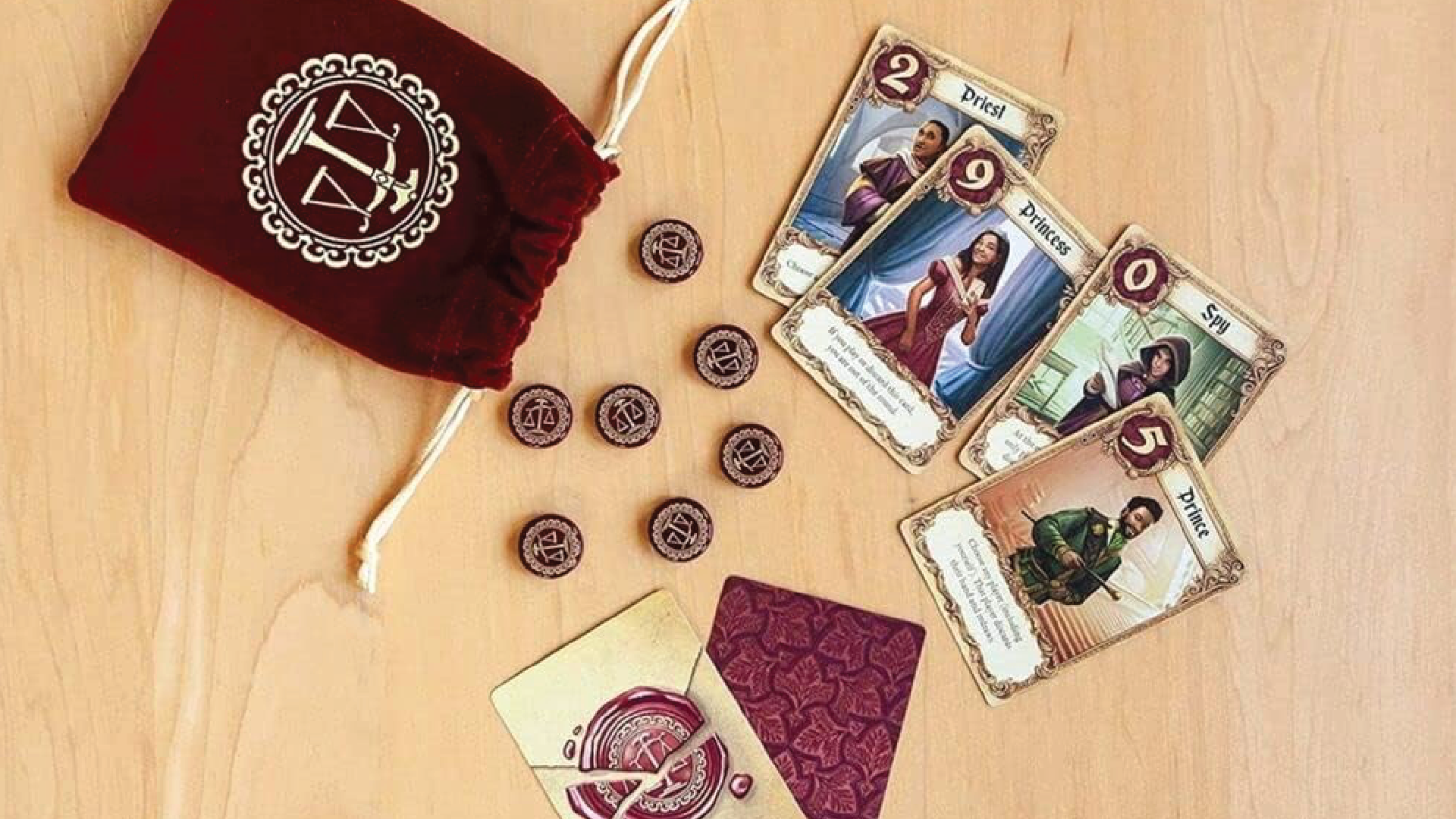 The drawstring bag and components for the Love Letter game.
