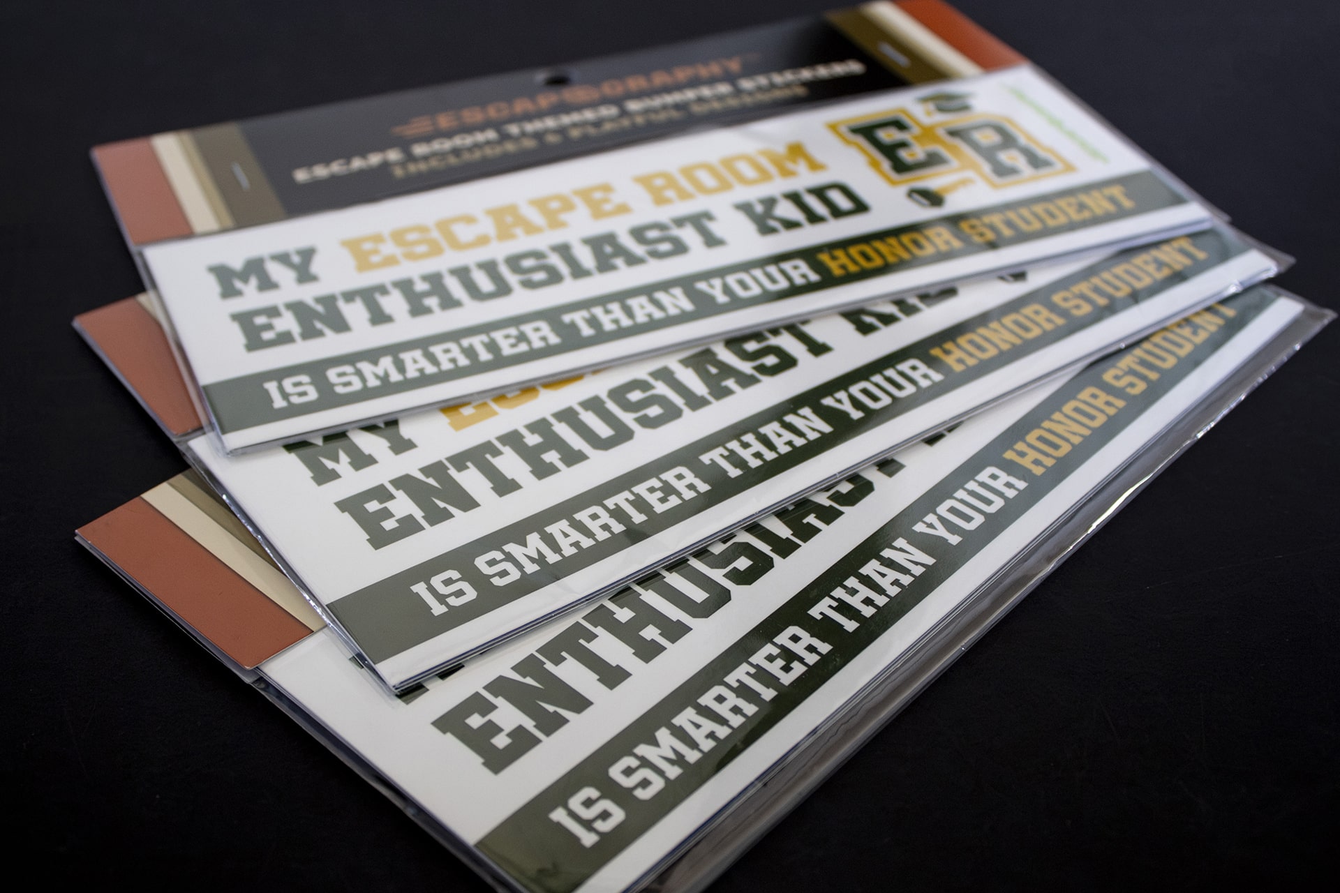Three bumper sticker sets fanned out.