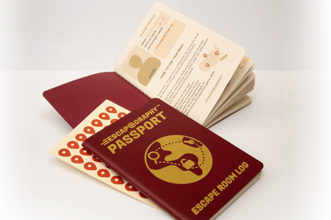 An arrangement of two passport-style notebooks, with stickers.