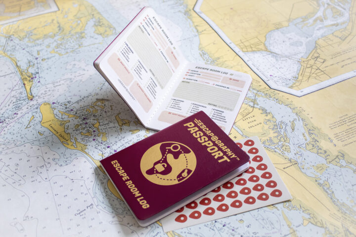 A photograph of the Escapography passport against a map.
