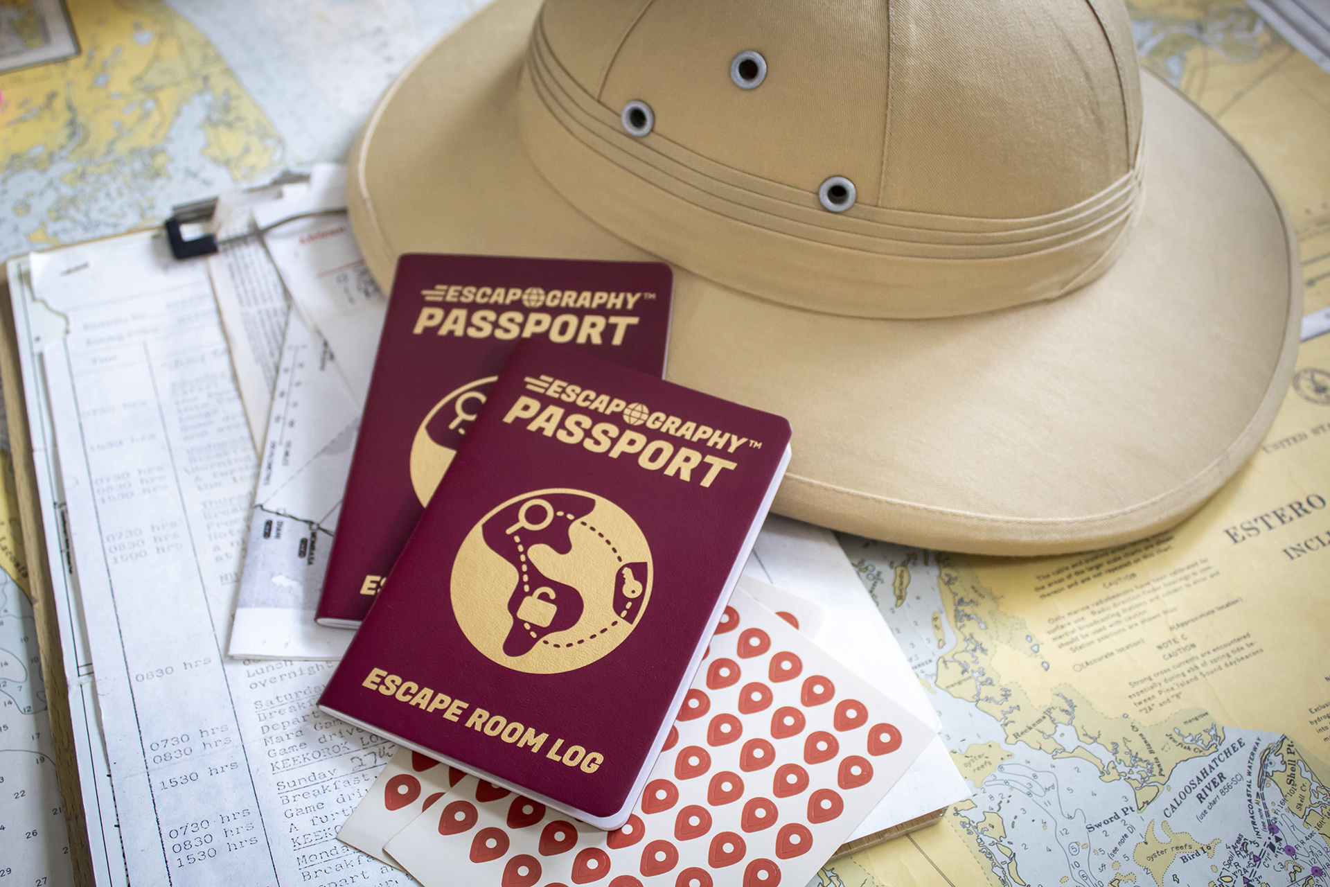 A photograph of the Escapography passport against a map.