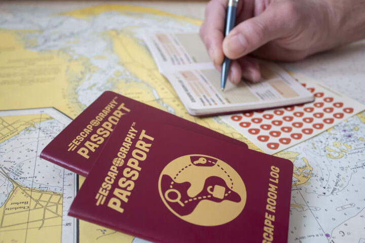 A photograph of the Escapography passport against a map.
