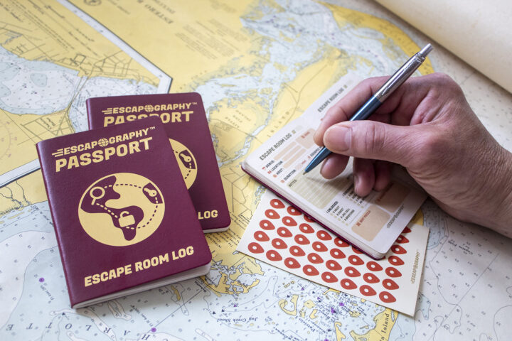 A photograph of the Escapography passport against a map.