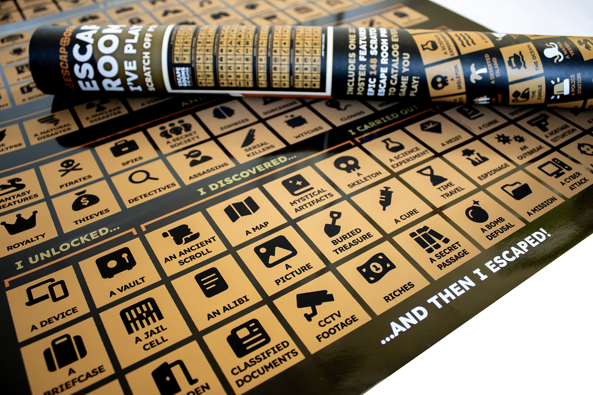 The scratch-off poster laid out, alongside the tube packaging.